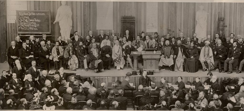 World's Parliament of Religion in Chicago, 1893, was an attempt to have an international dialogue of many faiths. The photograph shows a large gathering of fifty or more men and women.