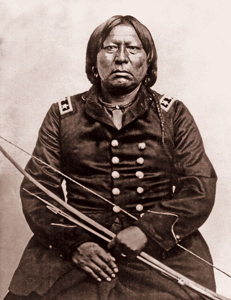 Kiowa Chief “Sétèmqíà is shown seated with one hand laid upon his lap and another grasping a bow and arrows. He is pictured wearing Major General Winfield Scott Hancock's officer's uniform purportedly borrowed. 