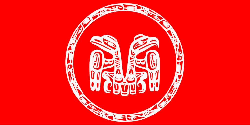An encircled design featuring opposing eagle and raven motifs symbolizes the two social clans in Haida society. The red background may represent the culturally significant red cedar tree or serve as an assertion of recognition. Together, the flag represents Haida national sovereignty.