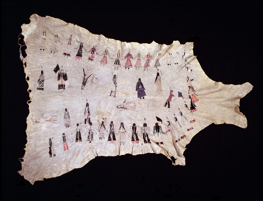 Southern Cheyenne painting on deerskin depicts the Ghost Dance, 1892. The hide is a bleached cream color. The Cheyenne people are shown in a sacred circle wearing colorful costumes. In the center 