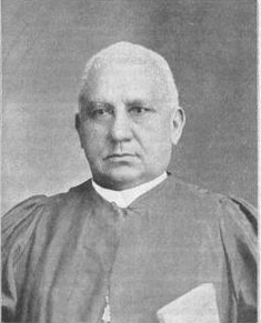 The Reverend Henry McNeal Turner is shown in clerical robes and collar, holding a Bible. He was a politician and minister, serving as the first Black chaplain for the United States Colored Troops in 1863.