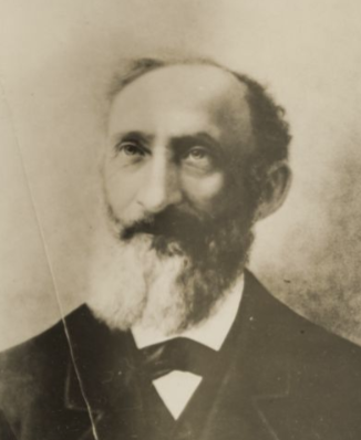Photograph of Bavarian immigrant, Talmudic scholar, and Union soldier Julius Ochs. Ochs is shown balding with a full beard in a black suit and tie and a white shirt. 