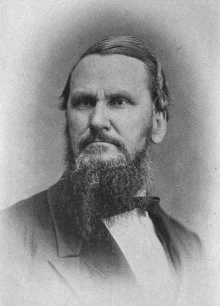 Portrait of Reverend Robert Dabney in a jacket, white shirt, and bow with an unkempt beard.