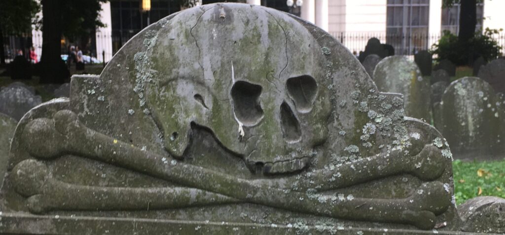 Death's Head, or headstone, is depicted as a skull and crossbones and is from a Puritan graveyard in Boston, Massachusetts.