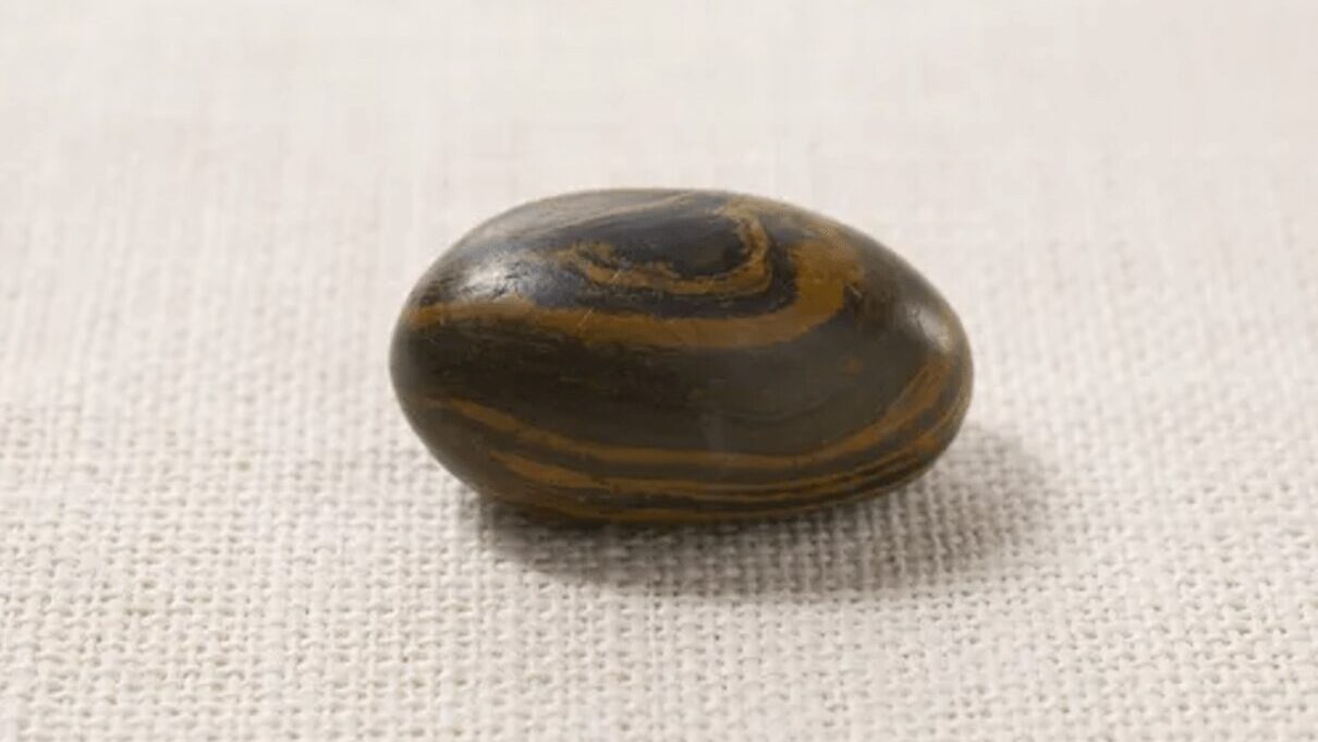 This dark brown or black stone contains caramel colored swirls on the outside. Called the Seer stone by some, stones like this one were believed to provide a way for people, including Church of Latter-Day Saints member Joseph Smith, to receive revelations from God.