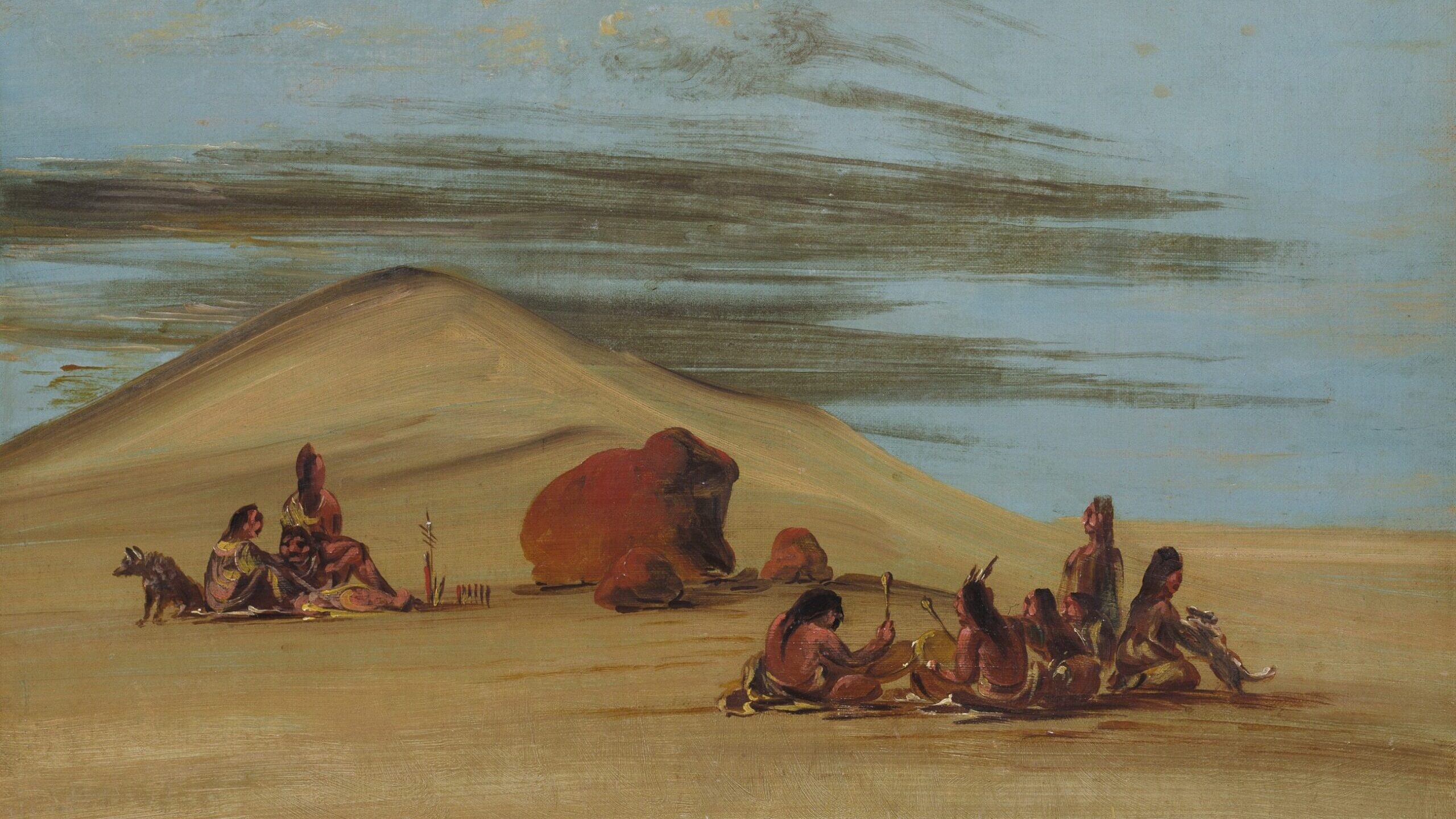 The painting shows Lakota people performing a religious ceremony in 1836. People sit at the foot of a hill. To the left are two American Indians with a dog at their side. One has their back to the viewer and has a Mohawk. A large boulder and two smaller ones to the right have been painted red. On the right side of the work sit six participants. Two are playing drums while one plays with some type of small animal. 