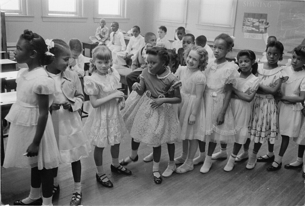 This photograph shows an integrated classroom of young children at the Barnard School post-Brown v. Board of Education, 1955.
